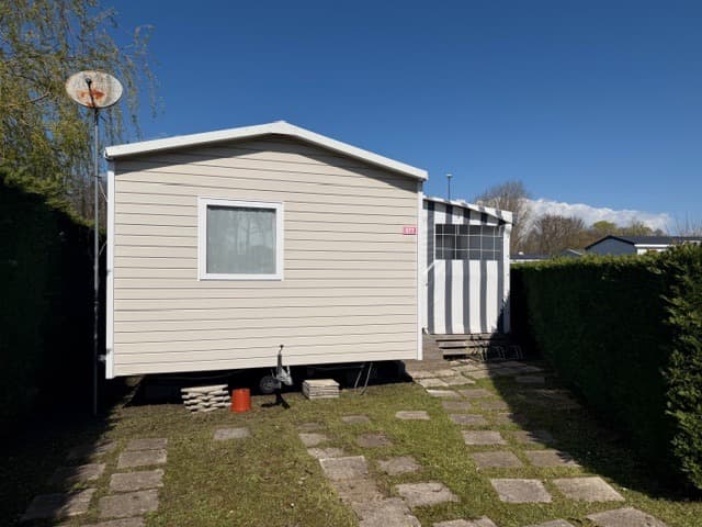 Salon et terrasse du mobil-home Mobil-home CC977 au camping Les Charmettes, La Palmyre